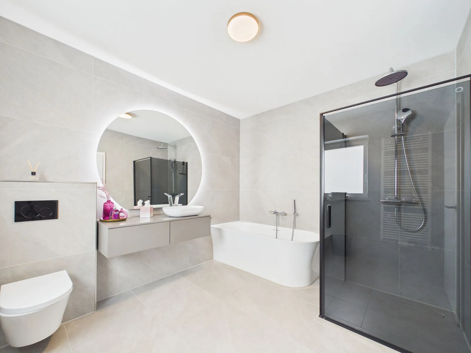 Spa-style bathroom with freestanding tub and rain shower